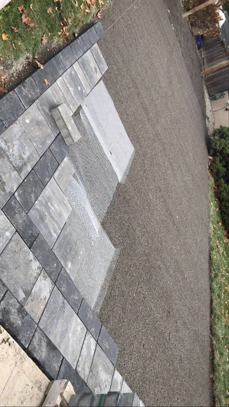 Gray and black interlock patio work in progress